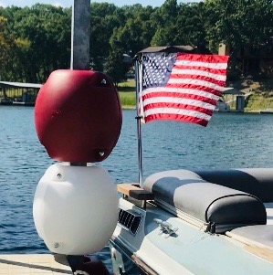 Red and White WhamGuard Rotating Boat Dock Bumper attached to post