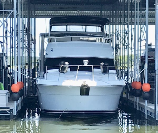 Orange & Black sets of WhamGuard Rotating Boat Dock Bumpers mounted on 2.5" boat dock posts.